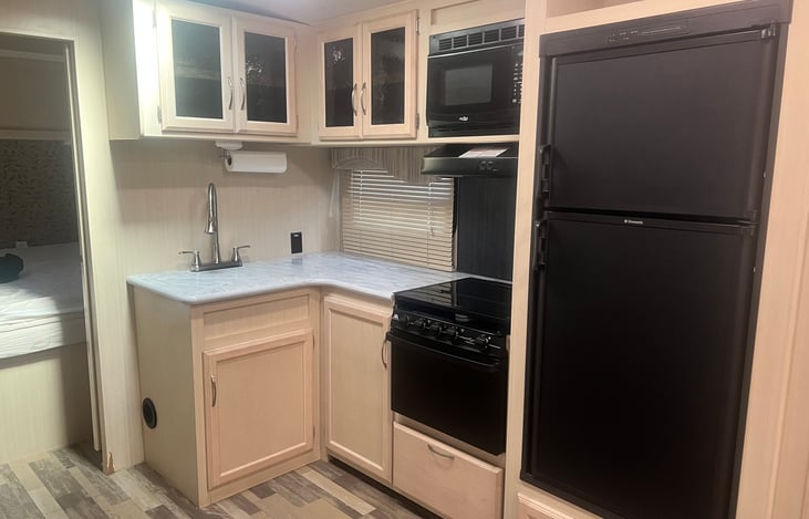 Dual sink kitchen, stove, oven, fridge, microwave