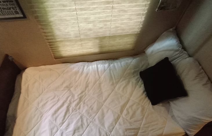 Dinette table area made into a twin bed sleeps 2