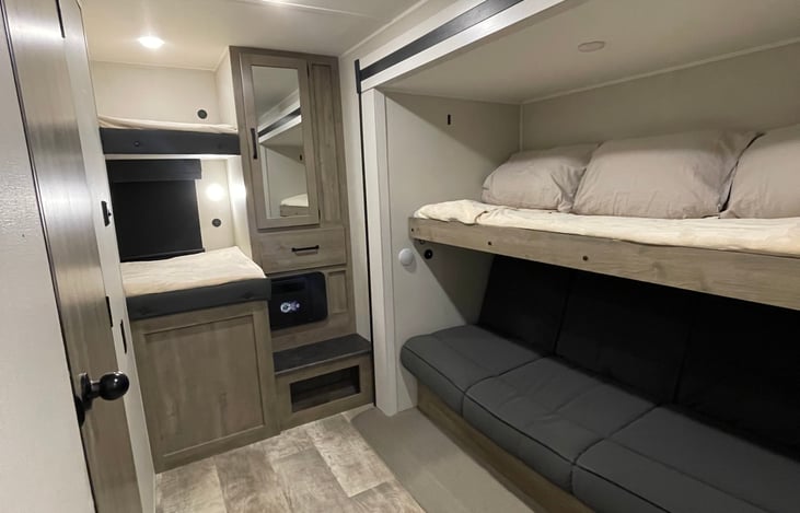 Spacious back bunk room with private bathroom.