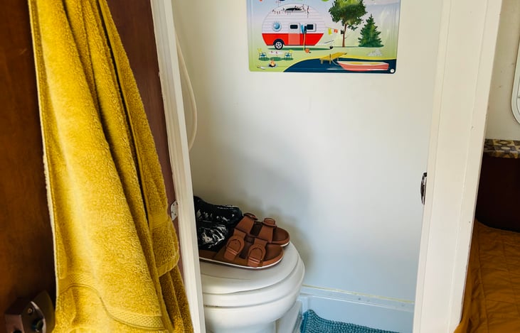 Toilet shown, but is not for actual use. I’ve never put water on the camper and it’s worked out nicely and I’m going to keep it that way. This little room is for storage.