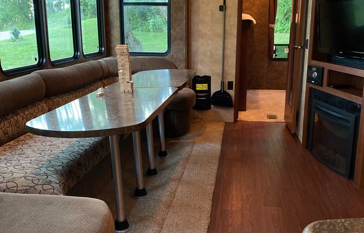 Living Space with a TV, Fireplace, Indoor/Outdoor Audio, Connection Cabinet full of games!