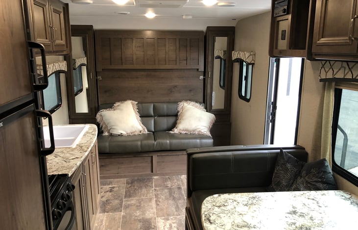 Interior facing rear. Couch folds into Queen Bed.