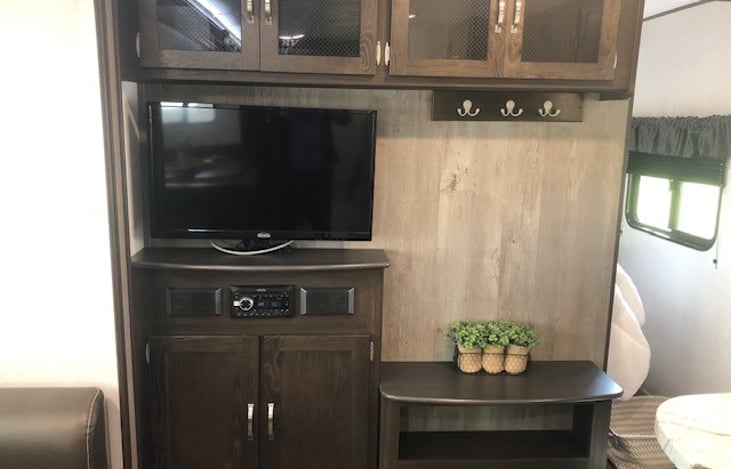 Entertainment center offers tv and indoor/outdoor 
bluetooth stereo