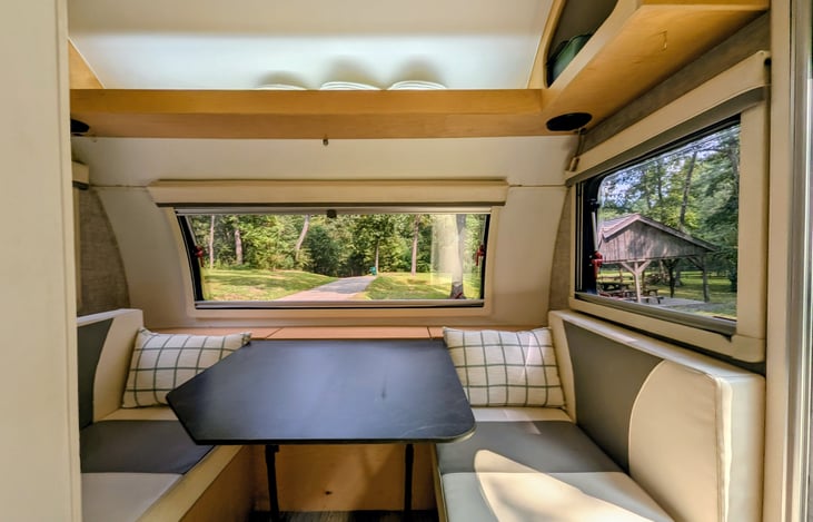 Cozy dinette surrounded by windows also converts to a second bed.