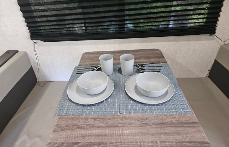 Just a example of the style bowls, plates, cups and silverware included with rental. The place are microwavable safe.