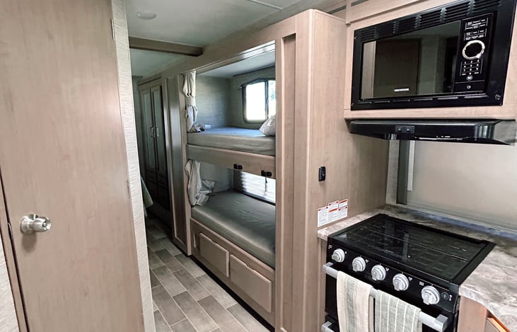 Two cabin sized bunk bed with tablet holders. Ladder is stowed away but easy to install!