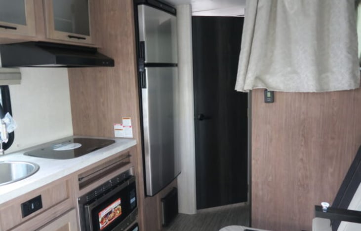 kitchen sink,stove, and microwave