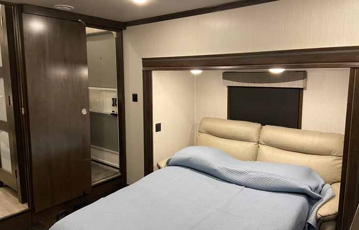 Rear room with hide a bed folded out, access to half bath - also exterior door access to half bath