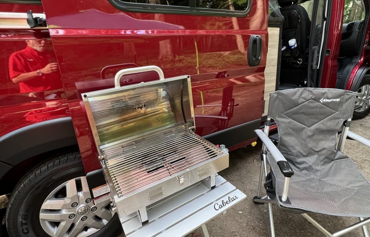 Our RV comes with a Tabletop Propane Grill and propane, incredibly comfortable KingCamp chairs, and 2' x 4' portable table (not pictured).