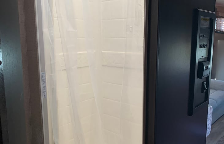 Shower with extended range rod