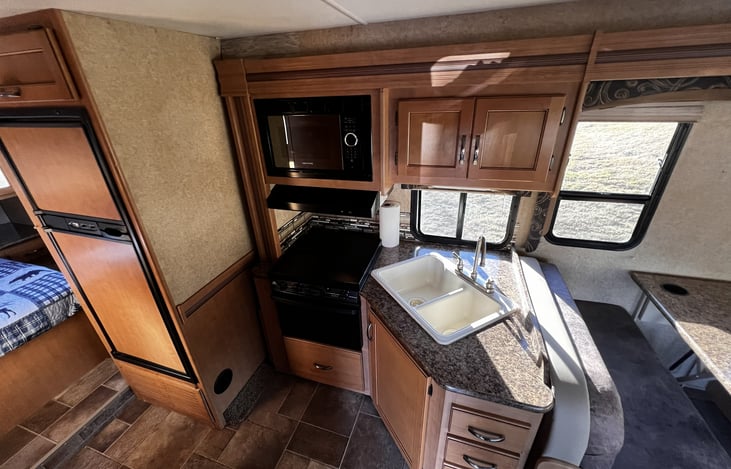 Kitchen Microwave, Refrigerator, Freezer, Stove/Oven and includes all plates, silverware, pots, pans, utinsels, towels and cleaning supplies.