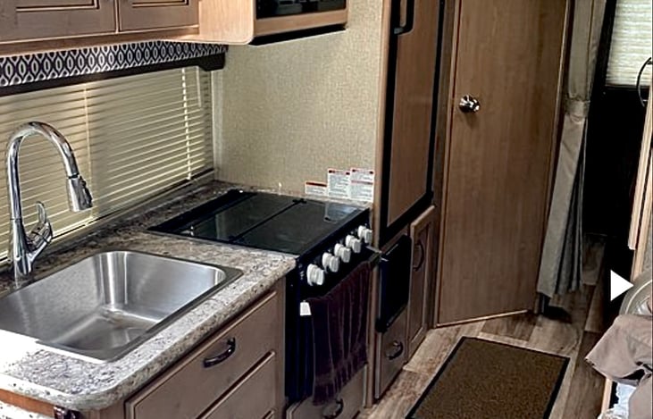 Kitchen equipped with all the essentials including coffee maker and toaster