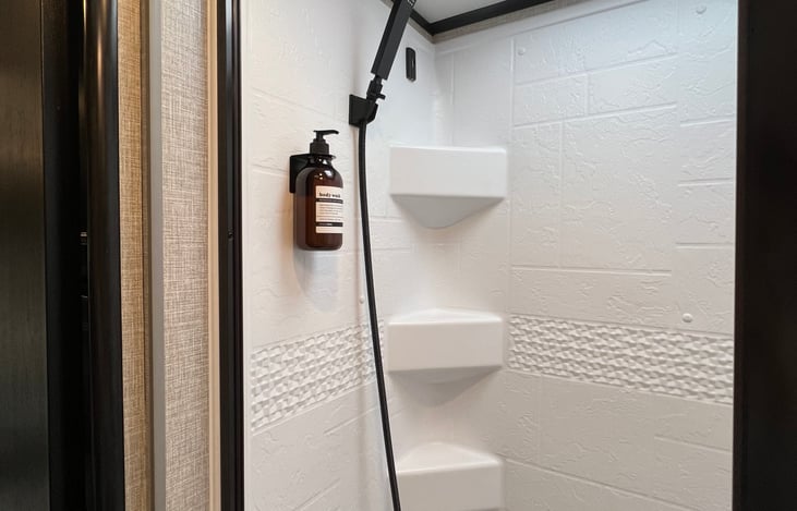 Big shower with organic body wash, shampoo and conditioner plus hand wash provided.