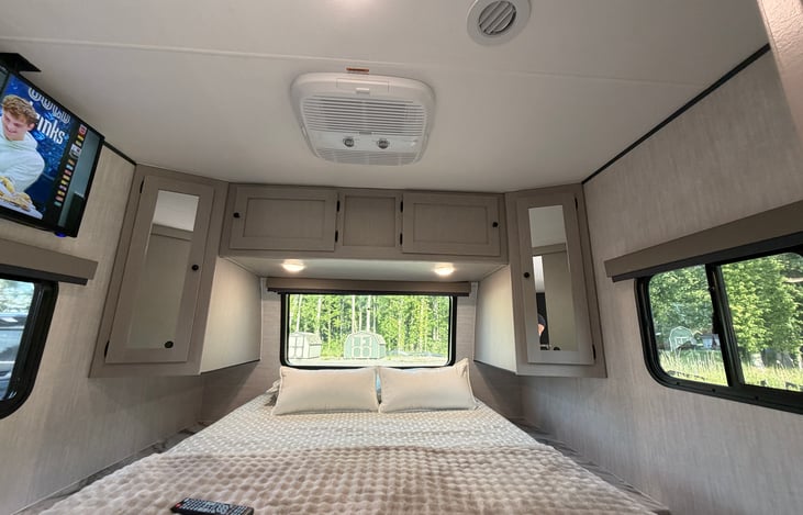 Large expansive windows with amazing views all around the bed.