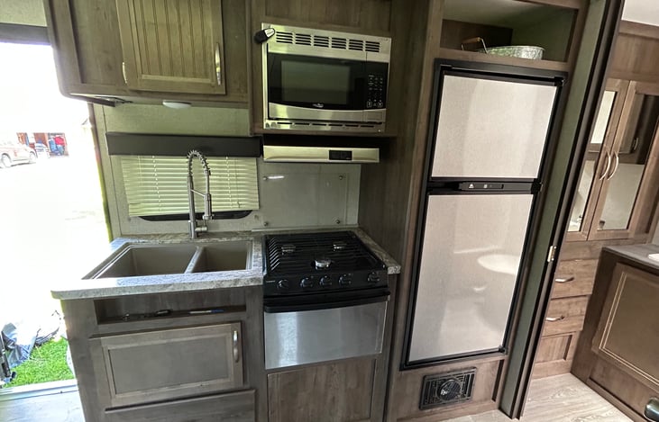 Kitchen equipped with storage and all the comforts of home.