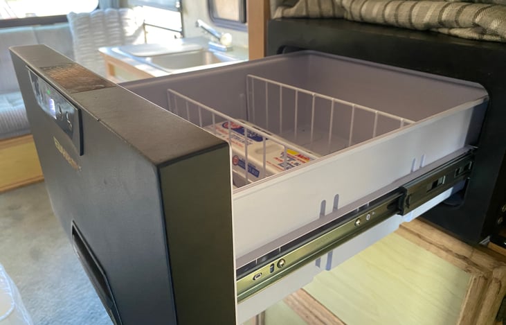 A state-of-the-art low-power DC drawer refrigerator is on all the time. The temperature can be set to be used as a freezer if you want.