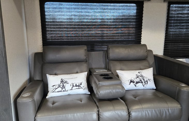 Couch has two recliners with heat and massage plus a drop down cupholder and phone charger arm rest.