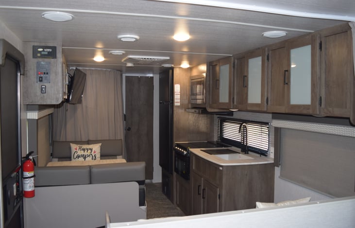 View from Bedroom to back of the camper. Privacy curtains on bunks is closed.