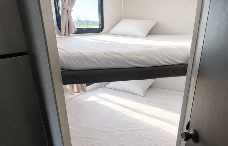 All beds come with fitted sheets. Please go to the 'add-on' section to add blankets and pillows if needed.