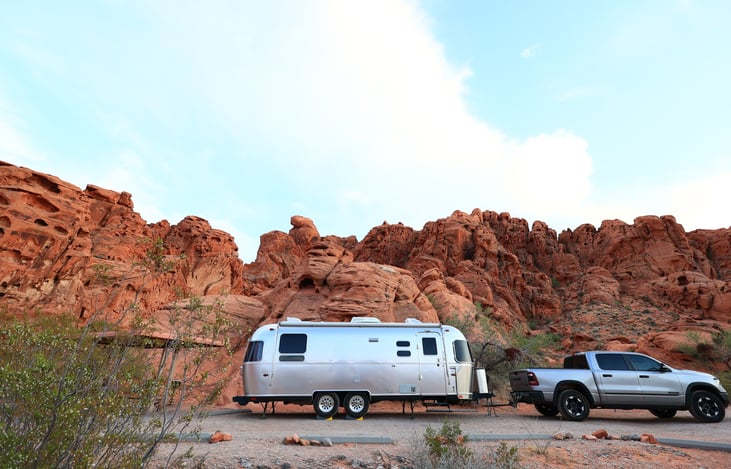 At 5,500lbs it is easily towable by 1/2 ton trucks and full sized SUVs.