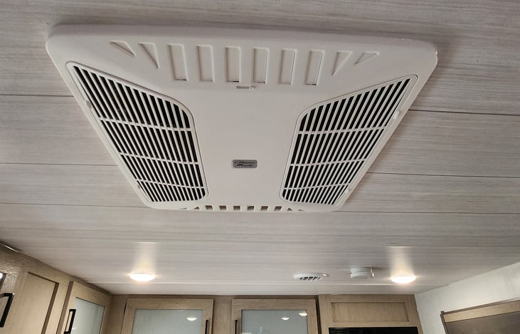A/C, Heat & Fan system with vents throughout the camper.