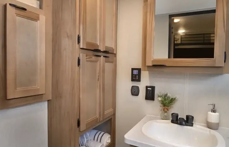 Porcelain toilet and lots of storage