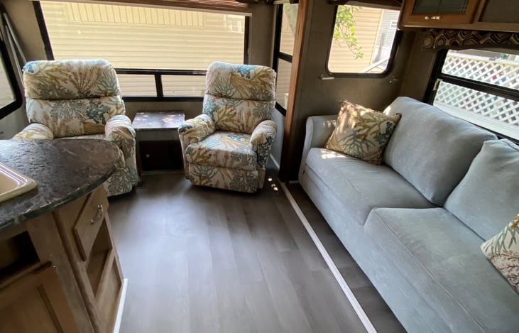 Queen fold out couch and two recliners.