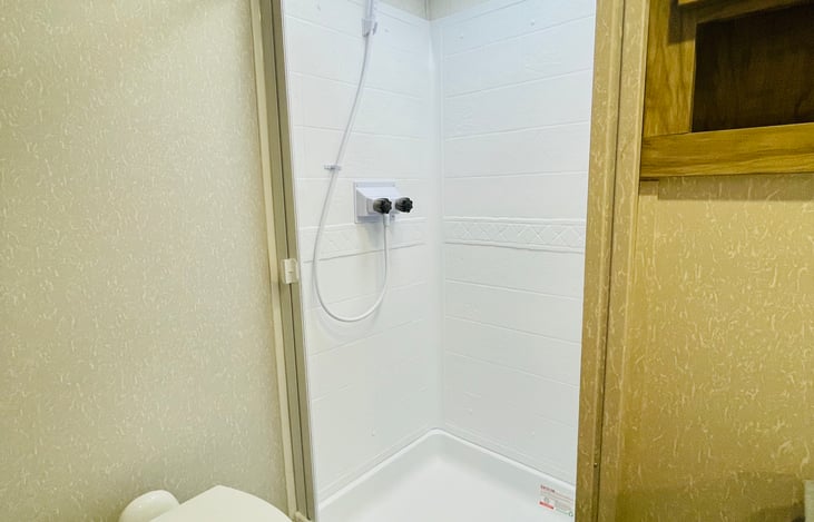 Porcelain Stool with Water Jet Assist and Foot Flush. Oversized Bathroom Attic Fan for Increased Interior Air Flow. Motion Sensing Night Light and Space Saver Sliding Door in Bathroom.