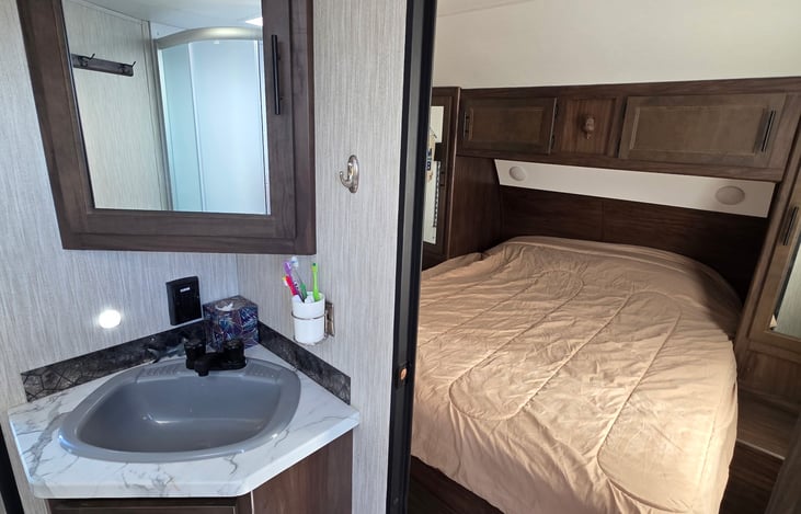 Master bedroom connects directly to the bathroom. Towel hanger and toothbrush holder keeps your bathroom organized.