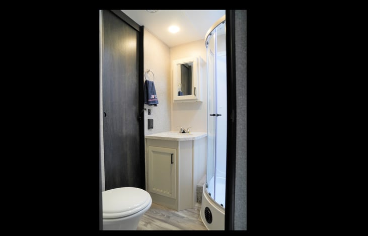 Beautiful bathroom with residential style stand up shower.