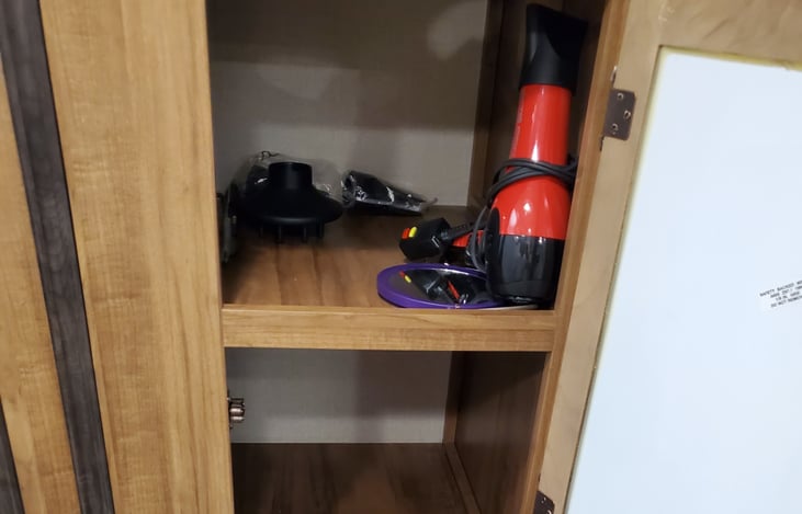 Hair dryer & flat iron on hand