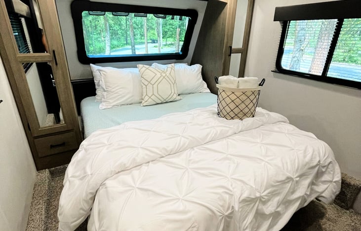 Master Bedroom features a RV queen memory foam bed. Forget those cheap uncomfortable mattresses that come with the RV. This upgraded mattress is memory foam and will help you get the best nights rest!