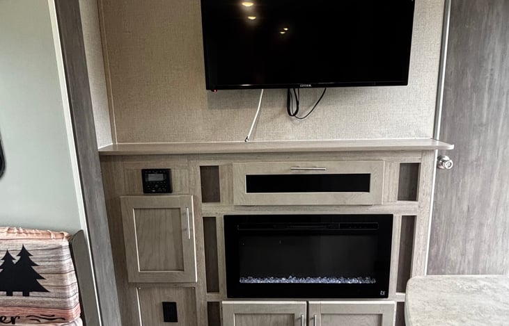 Entertainment center with bluetooth capability (speakers indoor and outdoor) and interior "fireplace".