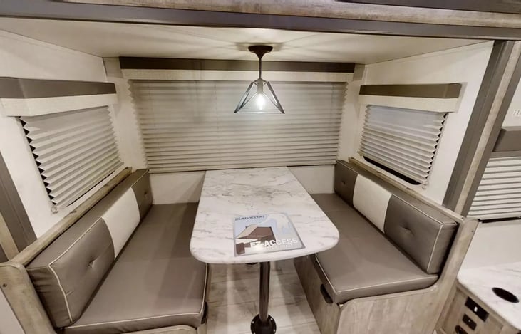 Dinette - with a sleeper conversion. Great space for 4 adults to comfortably sit, eat, play board games. The sleeper can sleep 2. But most comfortably 1