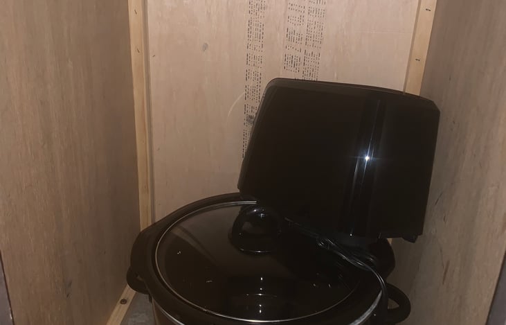 Left of sink- crockpot and toaster