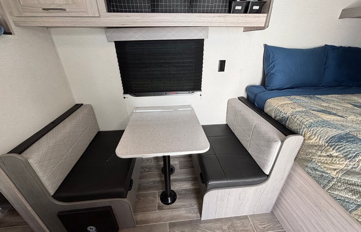Convertible dinette, storage, and Queen bed.