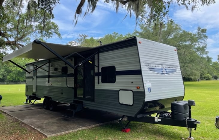 Drivers side showing the awning fully extended for a wedding event.