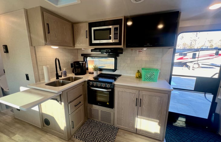 Kitchen, fully equipped with pots, pans, and a crockpot