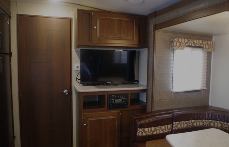 TV/DVD/Stereo/Bluetooth capable with added over the air antenna amplifier. 12V outlet behind TV