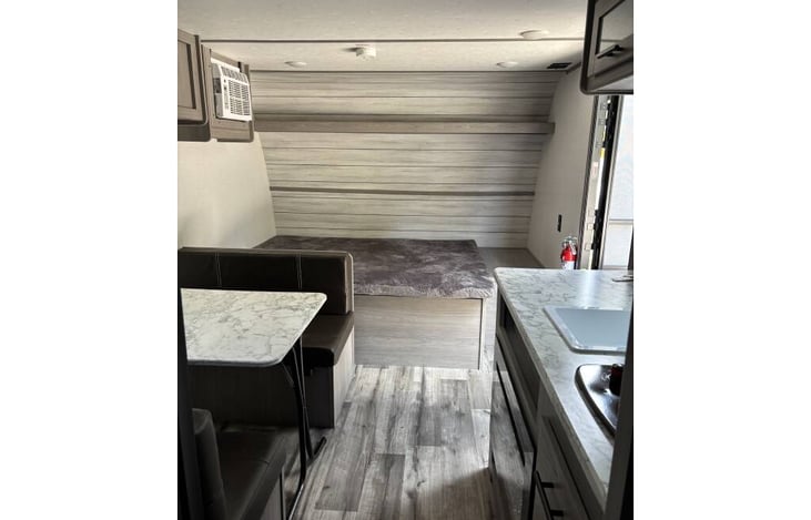 master bed, AC above the bed on the left, a TV has been added next to the door on the right