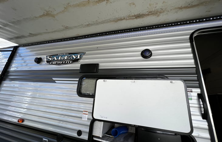 LED lights under awning, outdoor/indoor radio.