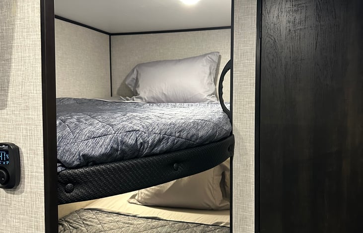 Both bunks. Size a little bigger than a full size bed.