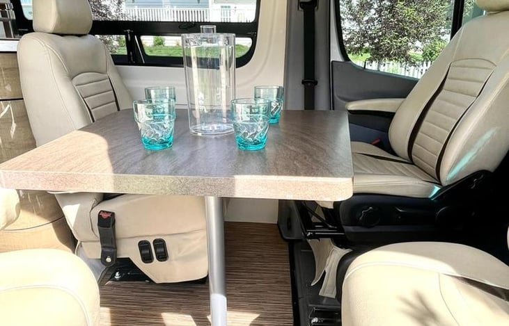 Additional view of roatated captain's chairs for seating around the table.