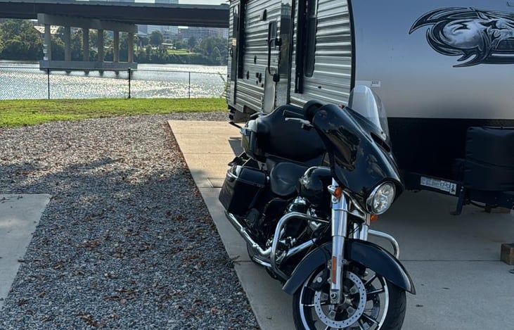 17. RV with Motorcycle
Adventure-ready! Cousin Kyle is the perfect luxury travel trailer for motorcycle rallies, road trips, state parks, and unforgettable camping vacations.