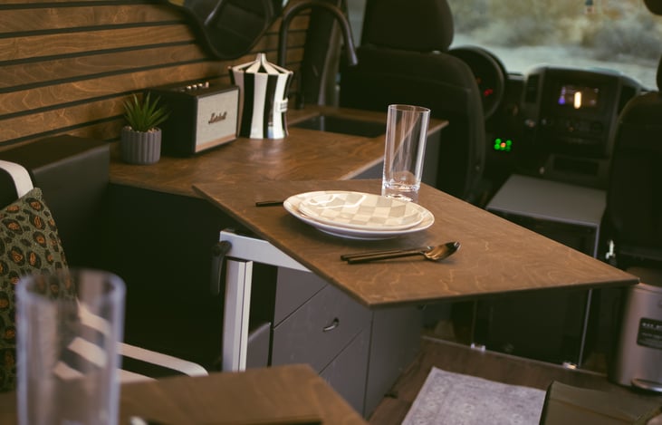 Comfortable dining for two, complete with stylish essential dining supplies.