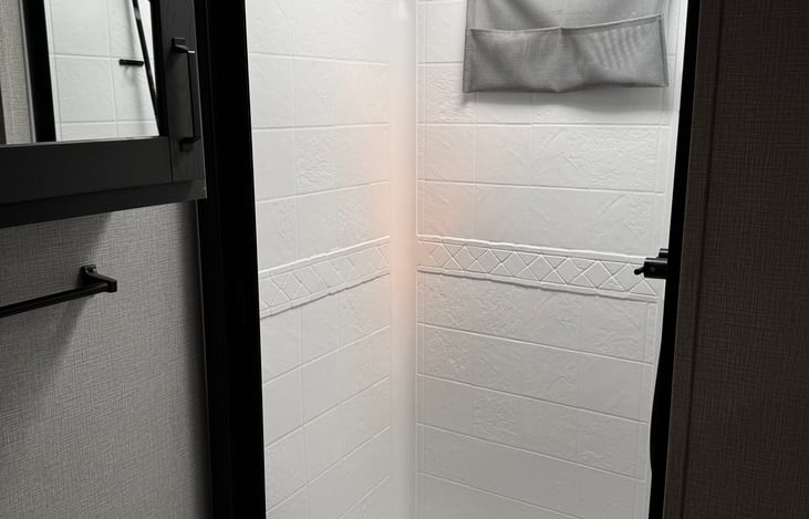 shower with retractable door