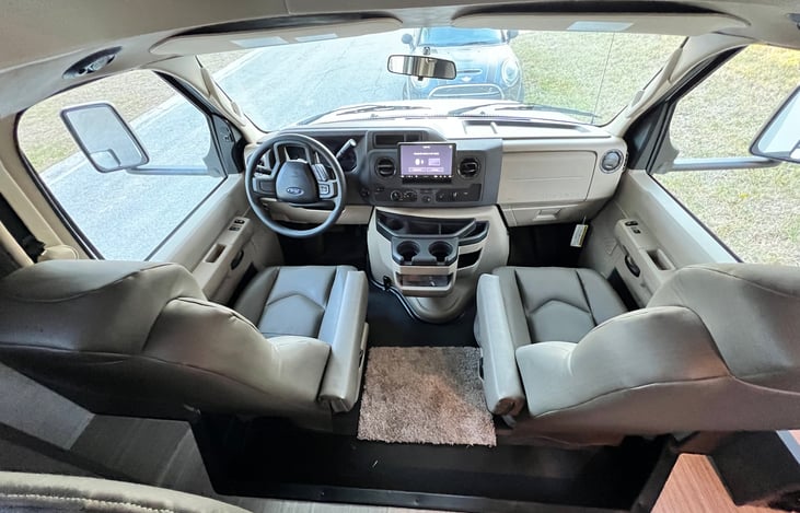 Comfortable driving area with a large touch-screen display, rear and side view cameras, plus connect to it via Bluetooth for your favorite music.