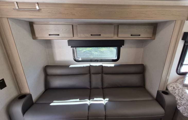 Couch with cup holders that pulls out to full size bed.