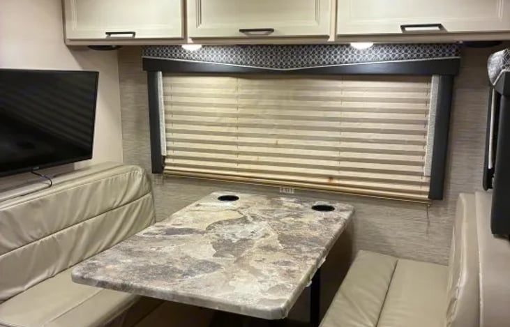 "Rolling Hills Retreat" has a 76" booth dinette equipped with high-strength lap belts. It drops down effortlessly into a 42" x 68" secondary bed.