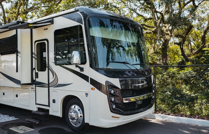 clean and newly polished coach.  2 awnings - one over the doorway and another over the seating/entertainment area.